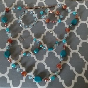 A set with a necklace, bracelet, and earrings